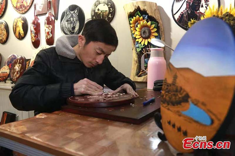 La culture de Dunhuang sculptée sur des planches