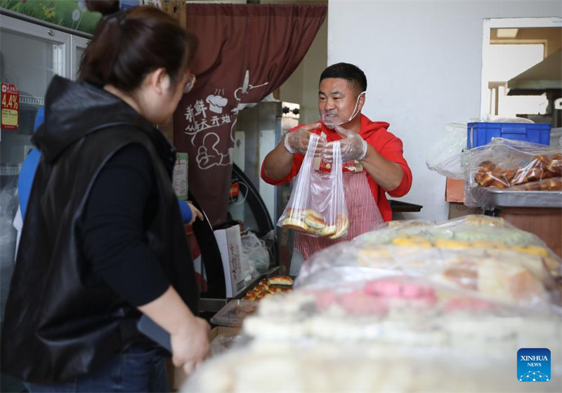 Liaoning : histoire en photos de la vie quotidienne d'un vendeur de biscuits de Yingkou